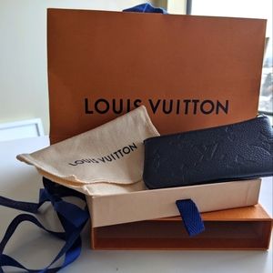 Key Pouch is Monogram Empreinte grained leather in a navy-blue hue